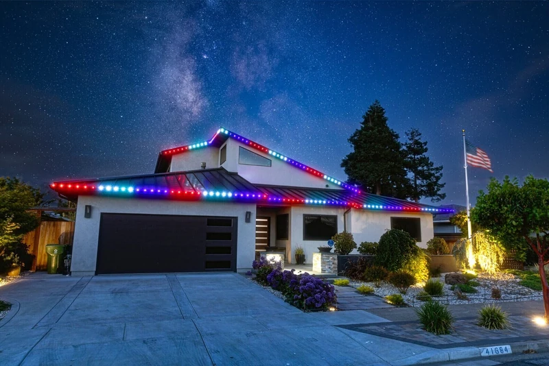 Commercial LED C9 style holiday lights along a residential roofline