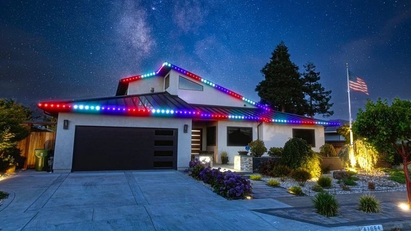 Patriotic red white and blue outdoor holiday lighting on a home
